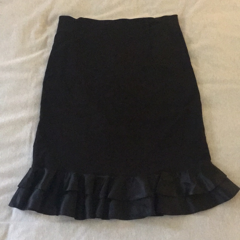 Nylon rayon spandex black below the knee skirt.